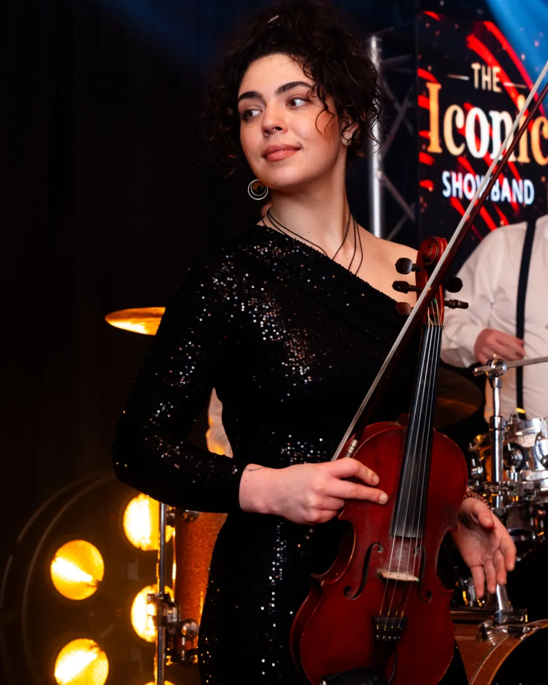 Violinist performing with the band